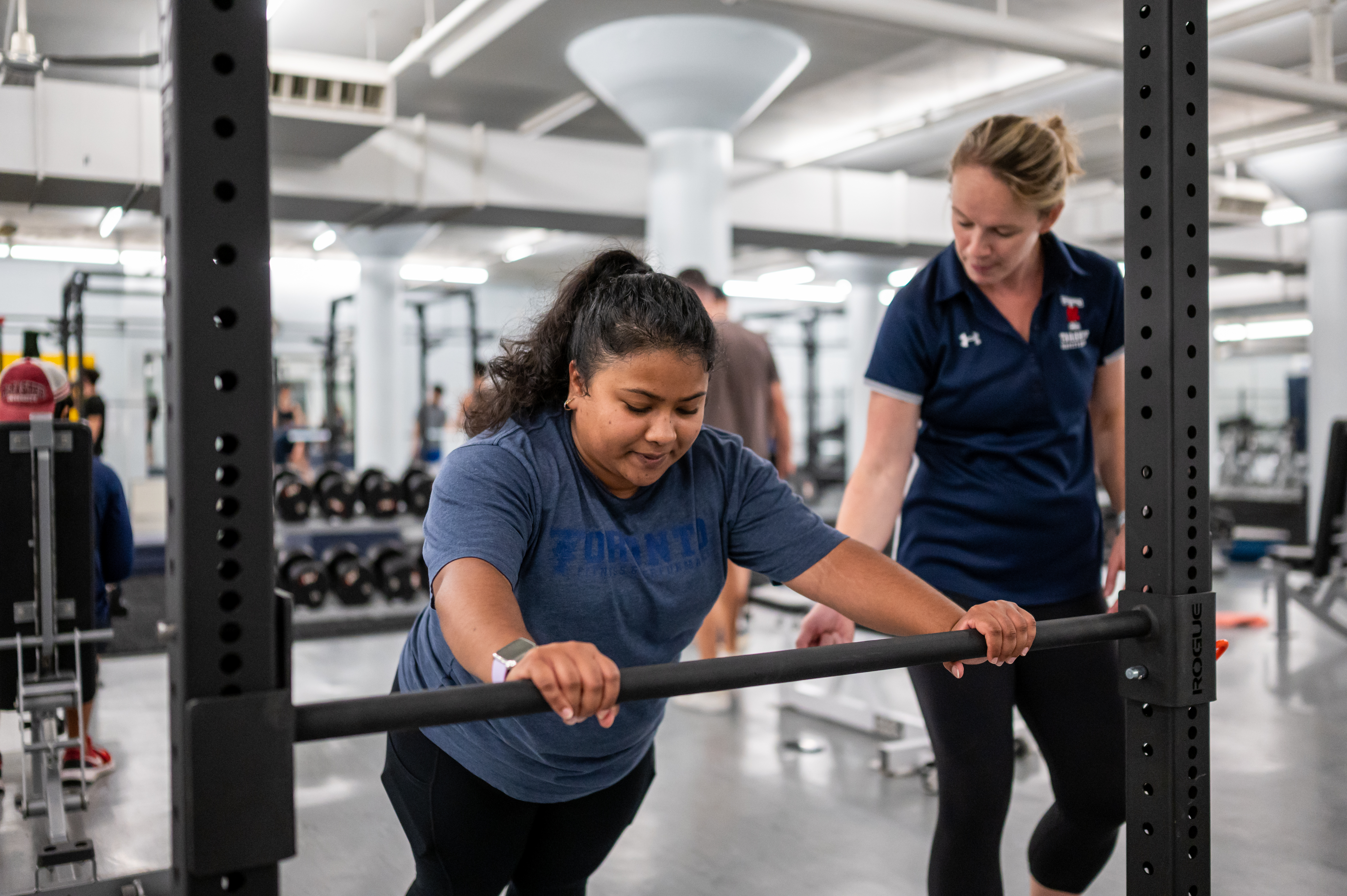 Trainer encouraging a female student 