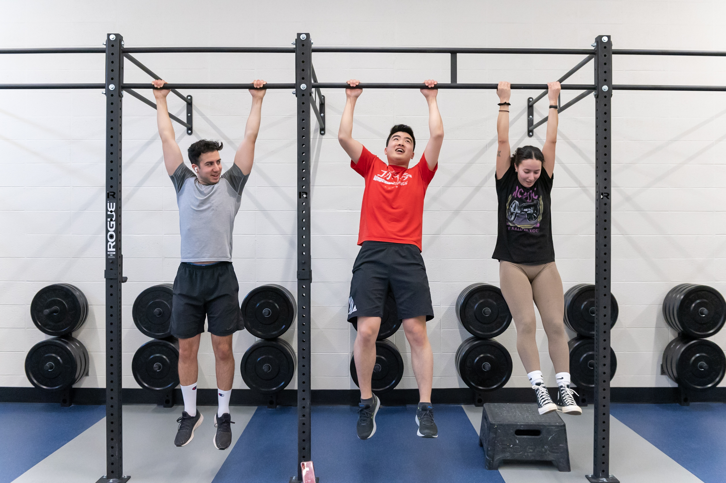 three people doing chinups on bar in Weightlifting Zone