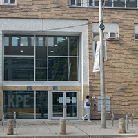 student walking past Huron Entrance of Clara Benson Building