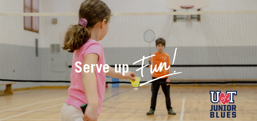 female child serves badminton shuttle