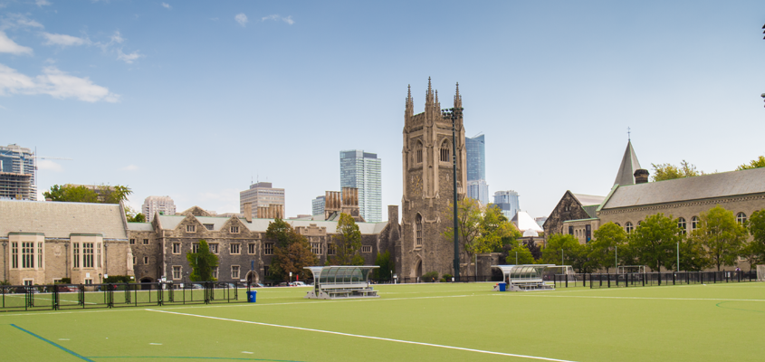 back campus field on a summer day