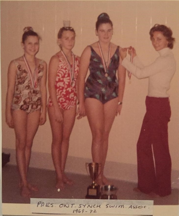Sheila presenting medals to three swimming athletes in 1972