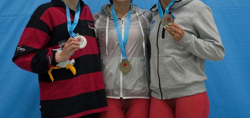 Varsity Blues swimmer Kylie Masse (centre) posing with fellow Olympians Dominique Bouchard &amp; Hilary Caldwell 