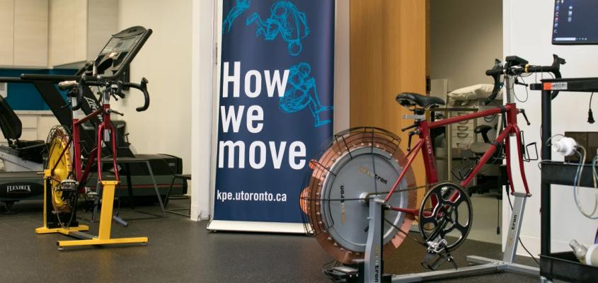 Shared research space on the fourth floor of the Goldring Centre featuring stationary bicycles (photo by Dewey Chang)