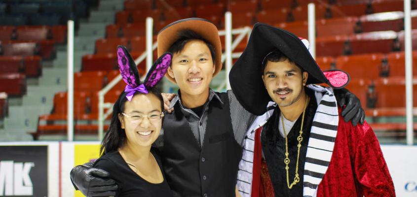 three students smiling