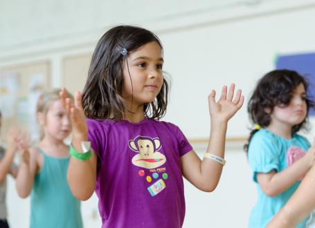 young kids learning to dance